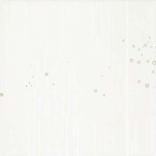 Close-up of microfoam textured steamed milk in a coffee pitcher